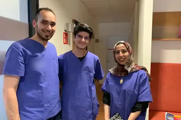 Three Medlingua healthcare professionals in scrubs