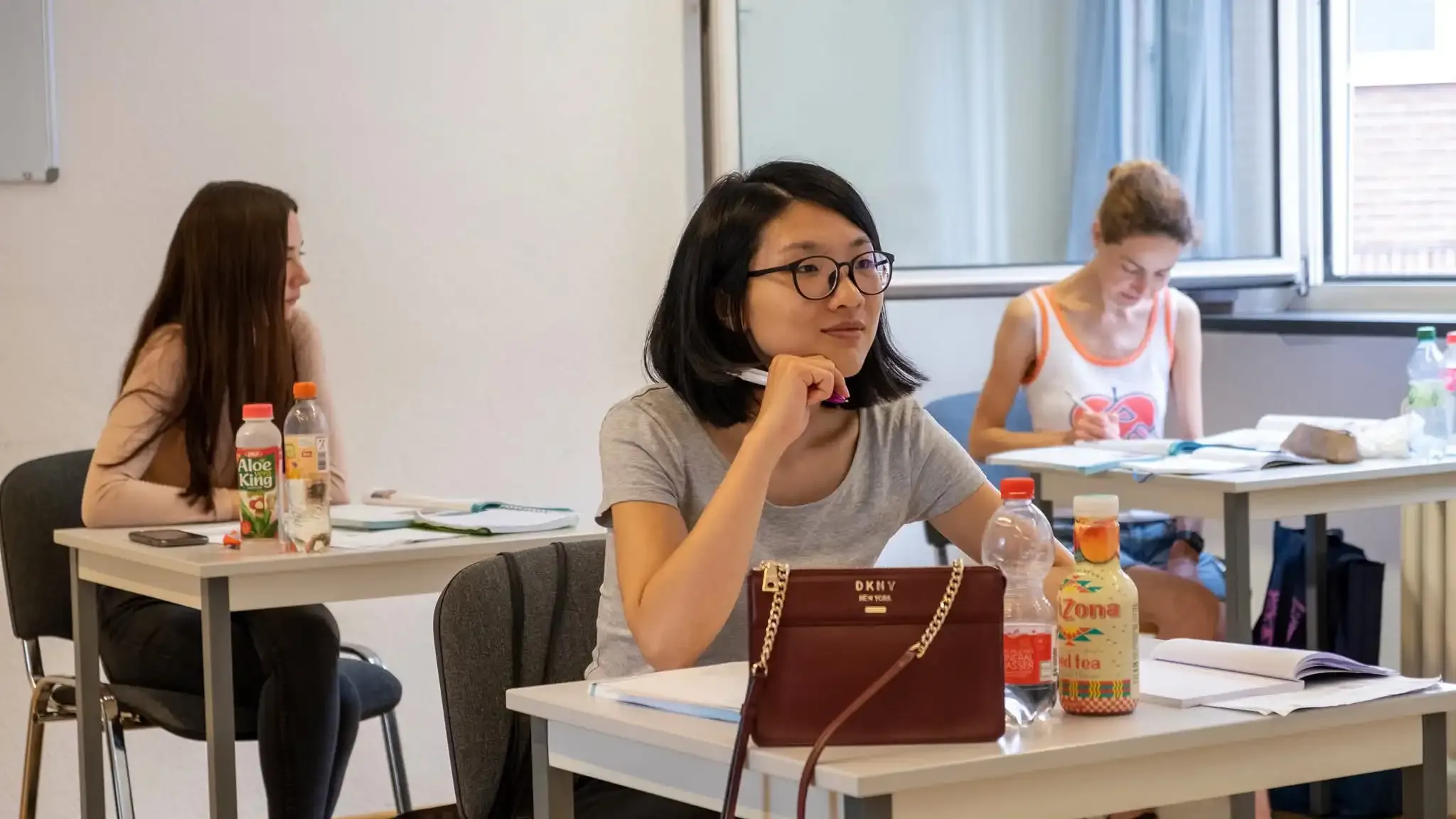A student listening closely in a German class